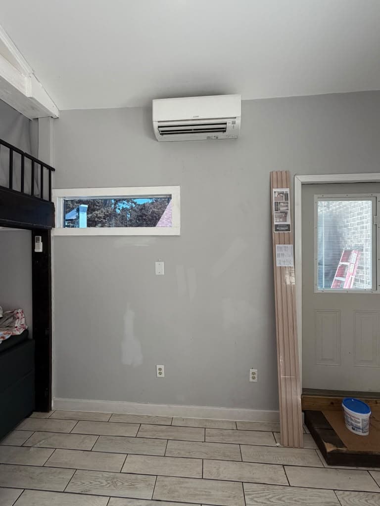 Plain gray wall before accent wall installation