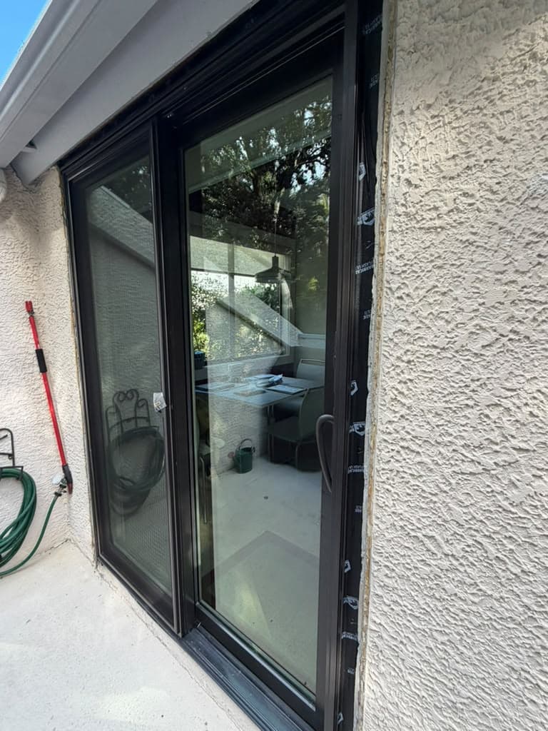Finished black-frame sliding patio door